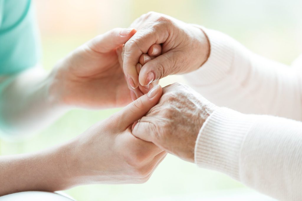 Personal care assistance hands in gentle light - Viva Senior Services Louisville, KY