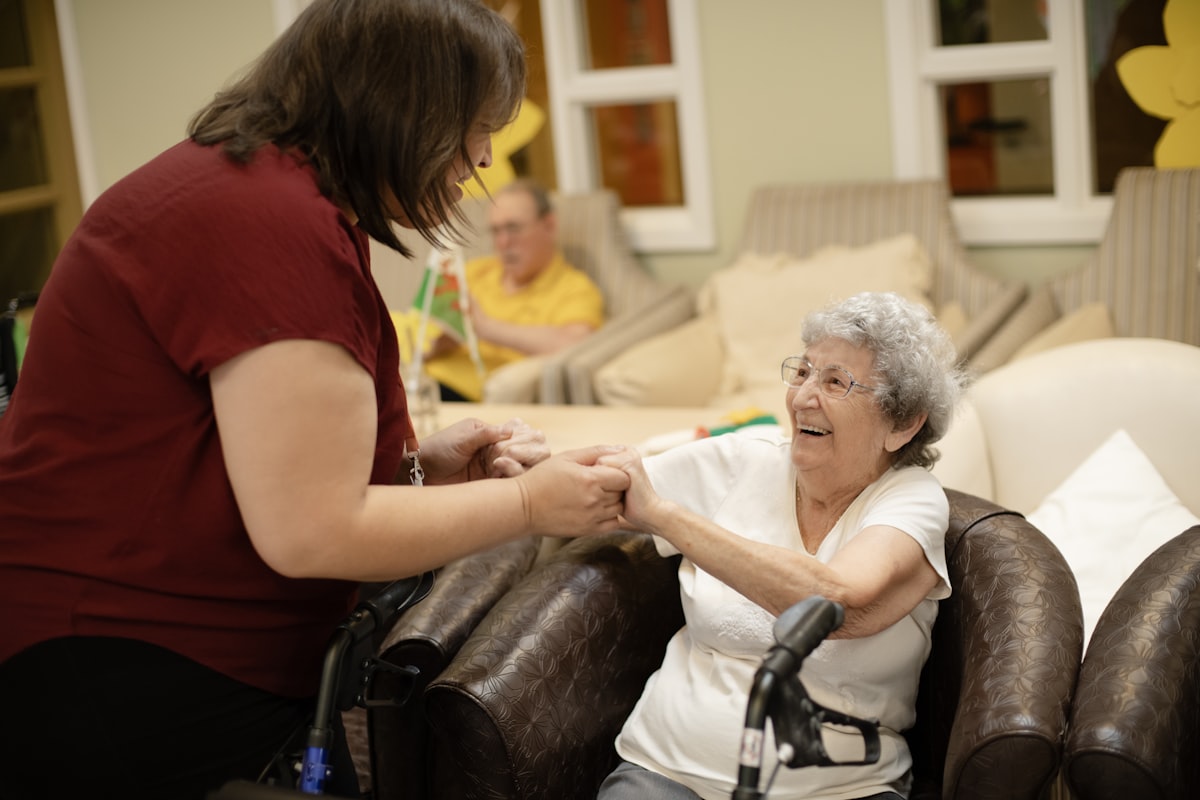 Caregiver assisting senior with mobility - Viva Senior Services Louisville KY